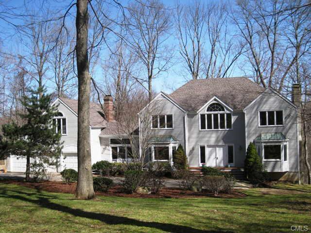 64 Valeview Road Wilton, CT 06897 - Photo 1 of 1 a front view of a house with a yard