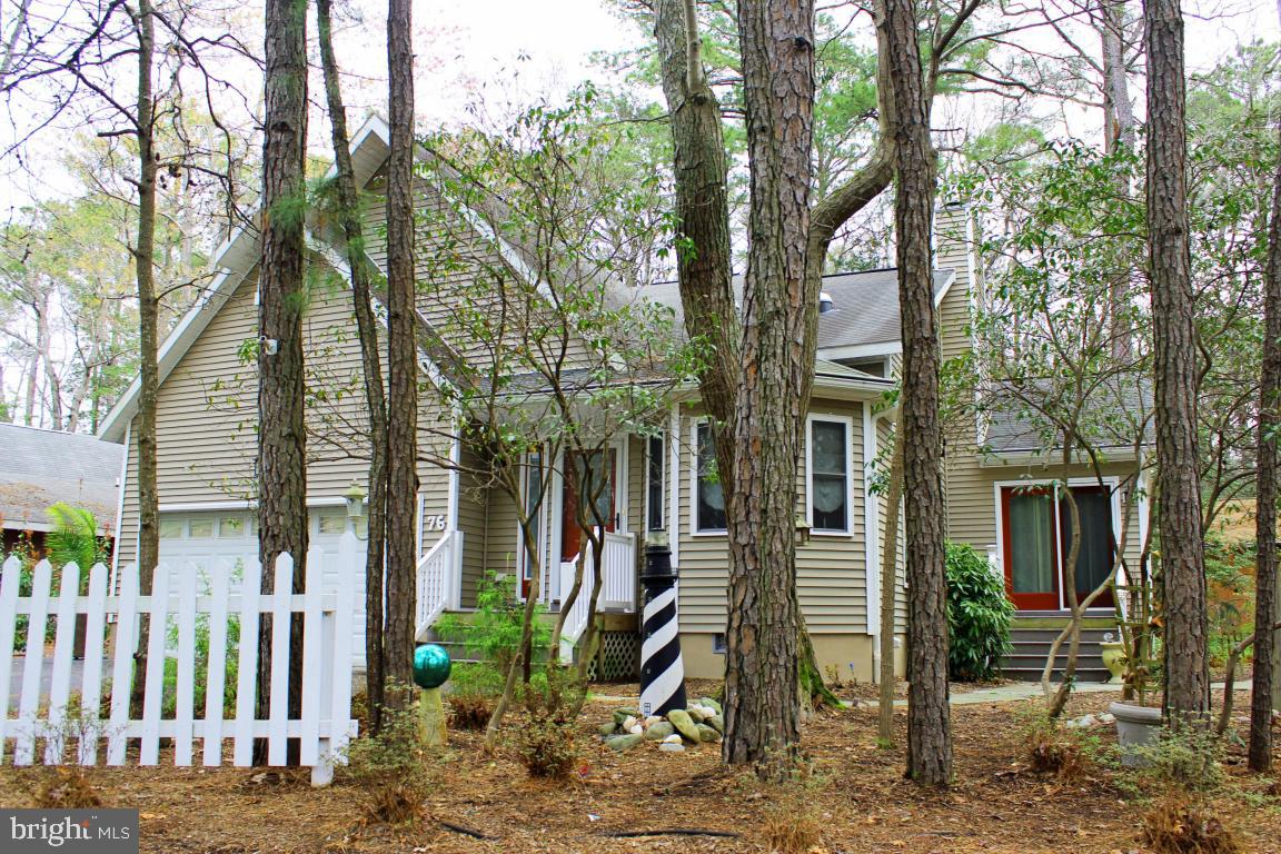 76 Pinehurst Road Ocean Pines, MD 21811 - Photo 1 of 23 a view of a house with a yard and large trees