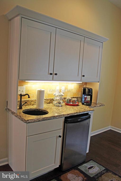 76 Pinehurst Road Ocean Pines, MD 21811 - Photo 12 of 23 a kitchen with a sink and cabinets