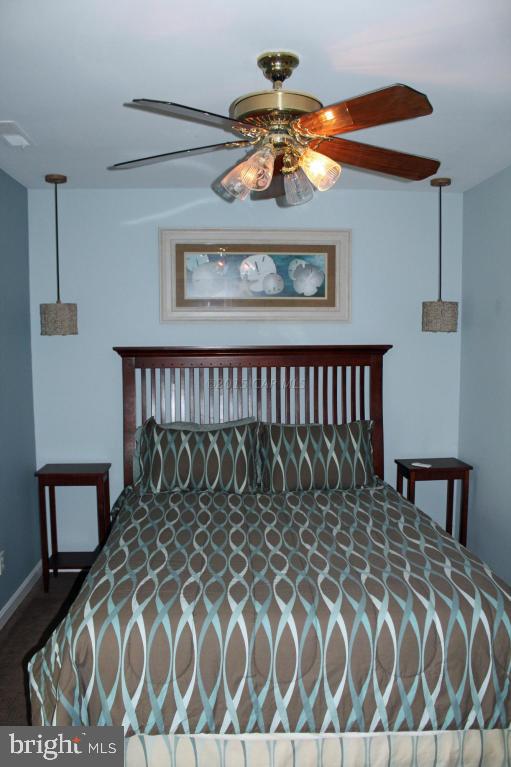 76 Pinehurst Road Ocean Pines, MD 21811 - Photo 17 of 23 a bed sitting in a bedroom next to a window