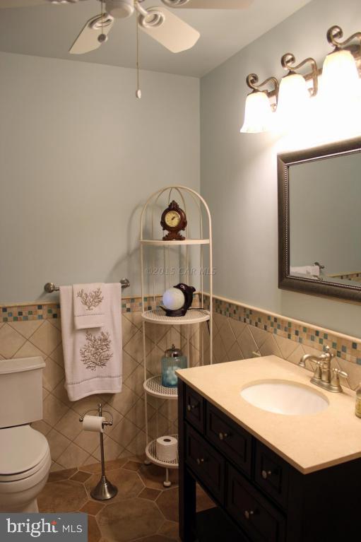 76 Pinehurst Road Ocean Pines, MD 21811 - Photo 19 of 23 a bathroom with a sink toilet and a mirror
