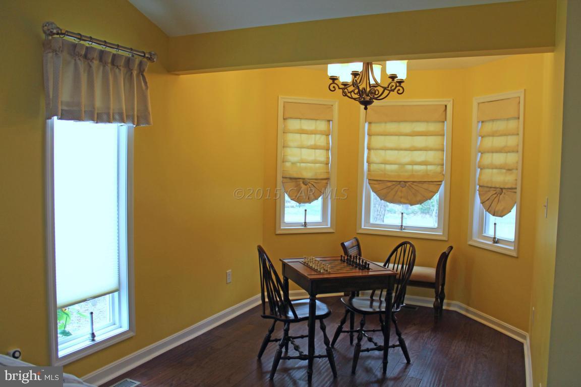 76 Pinehurst Road Ocean Pines, MD 21811 - Photo 4 of 23 a view of a dining room with furniture and a chandelier