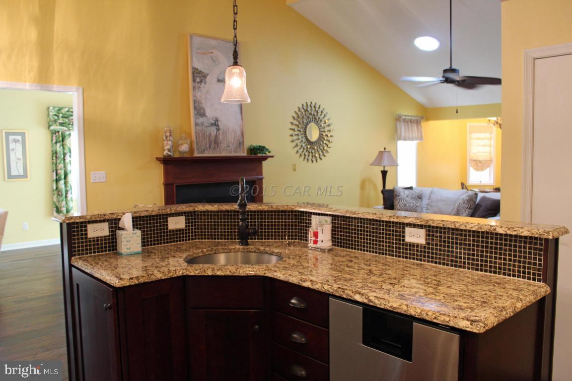 76 Pinehurst Road Ocean Pines, MD 21811 - Photo 7 of 23 a bathroom with a granite countertop sink a mirror and a window