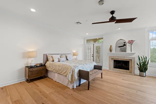 a bedroom with a bed and a fireplace