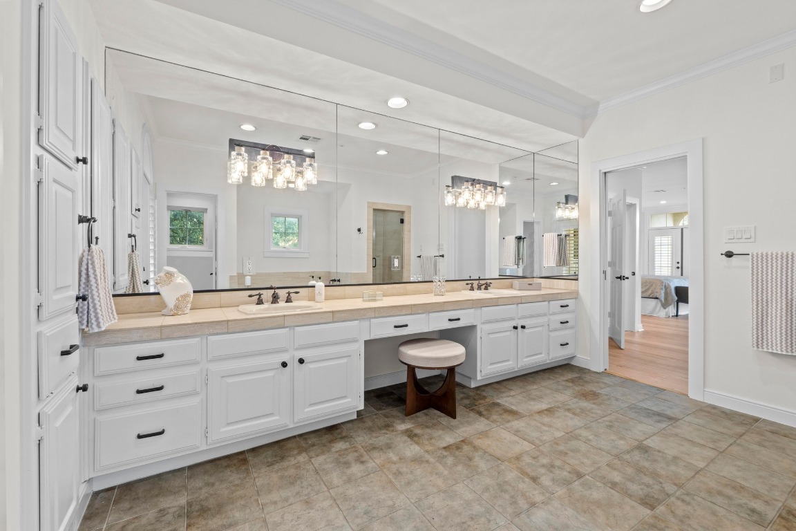 1937 Rue De St Tropez, Unit 5 Austin, TX 78746 - Photo 17 of 36 a spacious bathroom with a granite countertop sink mirror and a
