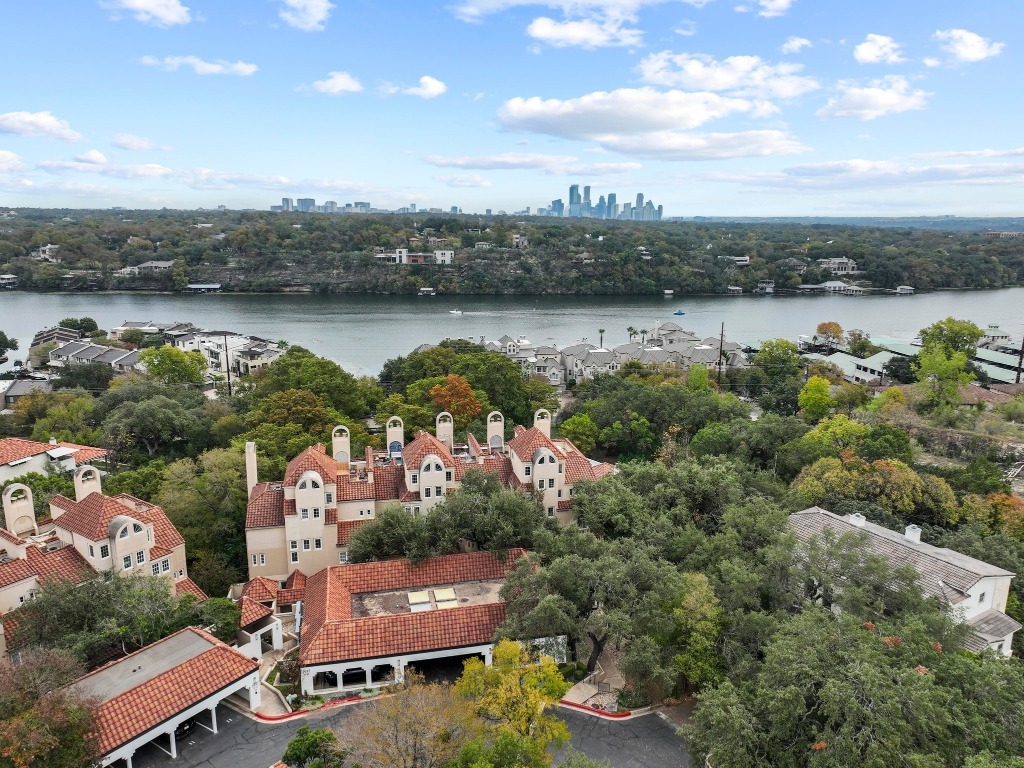 1937 Rue De St Tropez, Unit 5 Austin, TX 78746 - Photo 2 of 36 an aerial view of a house with lake view and mountain view