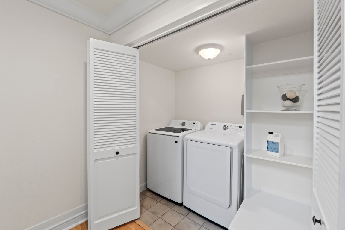 1937 Rue De St Tropez, Unit 5 Austin, TX 78746 - Photo 23 of 36 a utility room with dryer and washer