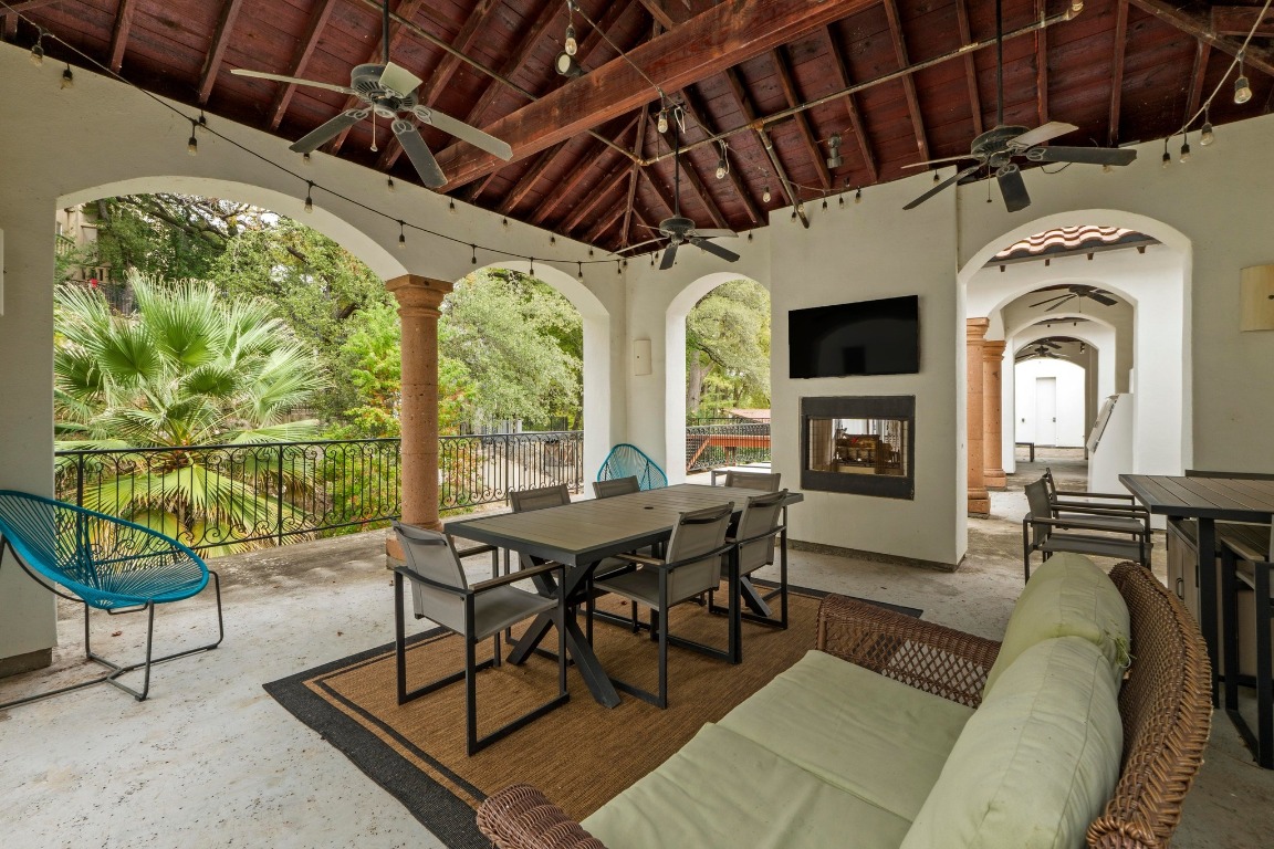 1937 Rue De St Tropez, Unit 5 Austin, TX 78746 - Photo 29 of 36 a view of a livingroom with furniture window and outside view