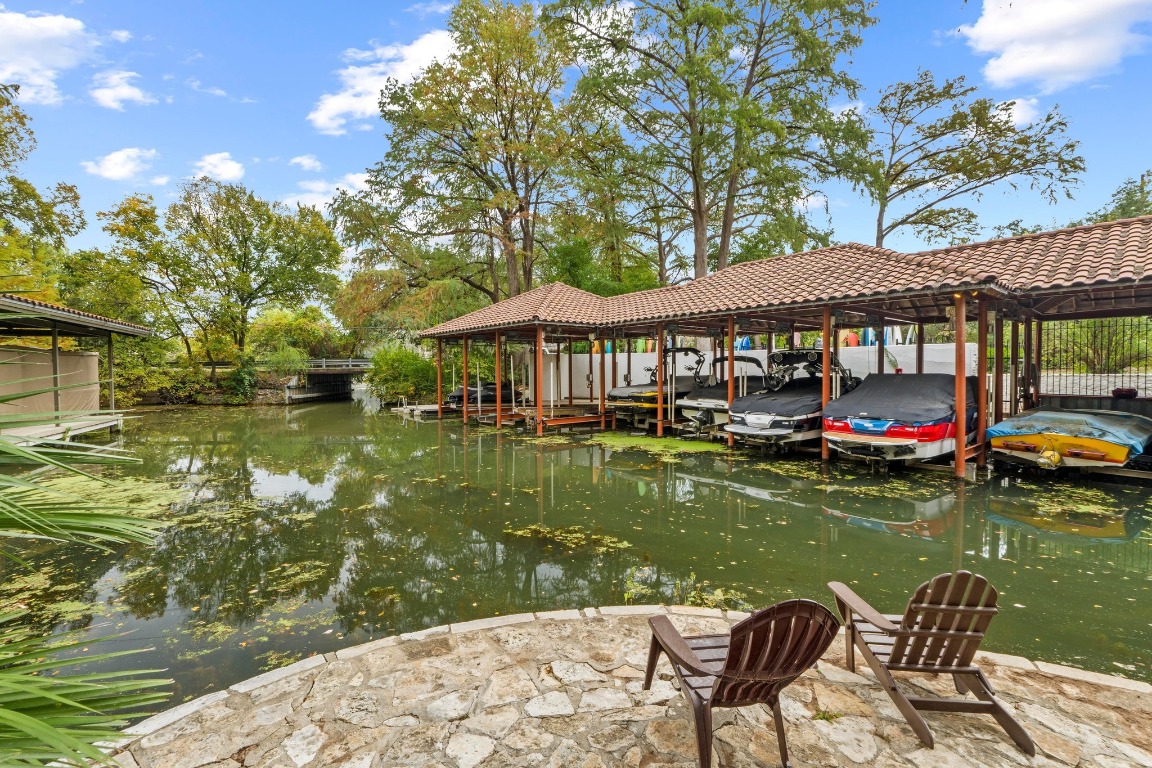 1937 Rue De St Tropez, Unit 5 Austin, TX 78746 - Photo 31 of 36 a swimming pool view with a lake view