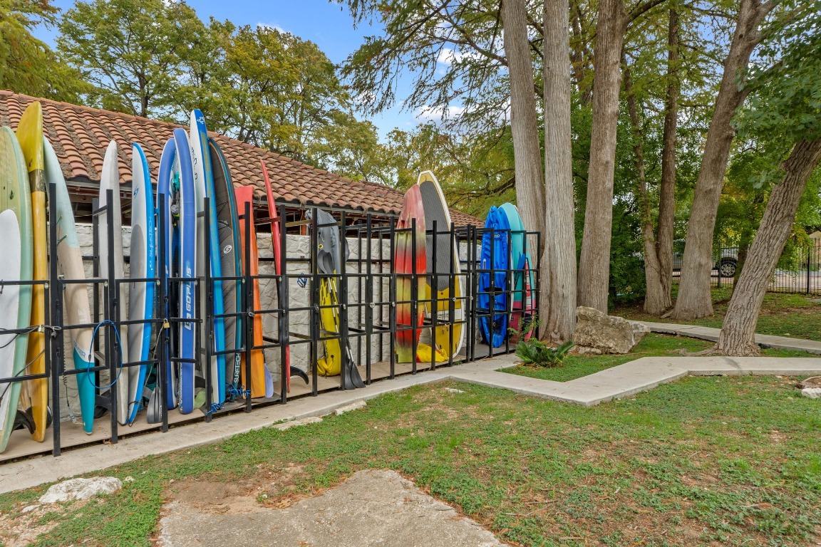 1937 Rue De St Tropez, Unit 5 Austin, TX 78746 - Photo 33 of 36 a view of a backyard with a trees