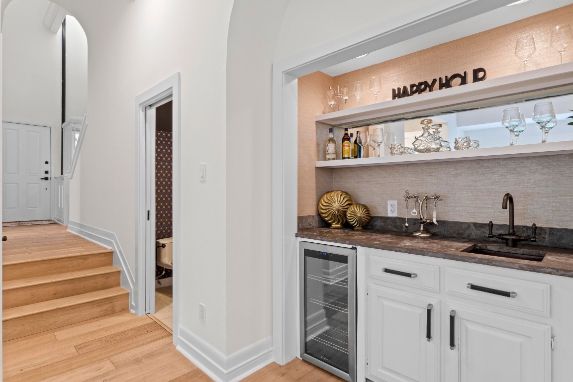 1937 Rue De St Tropez, Unit 5 Austin, TX 78746 - Photo 9 of 36 a kitchen with stainless steel appliances granite countertop a sink and cabinets