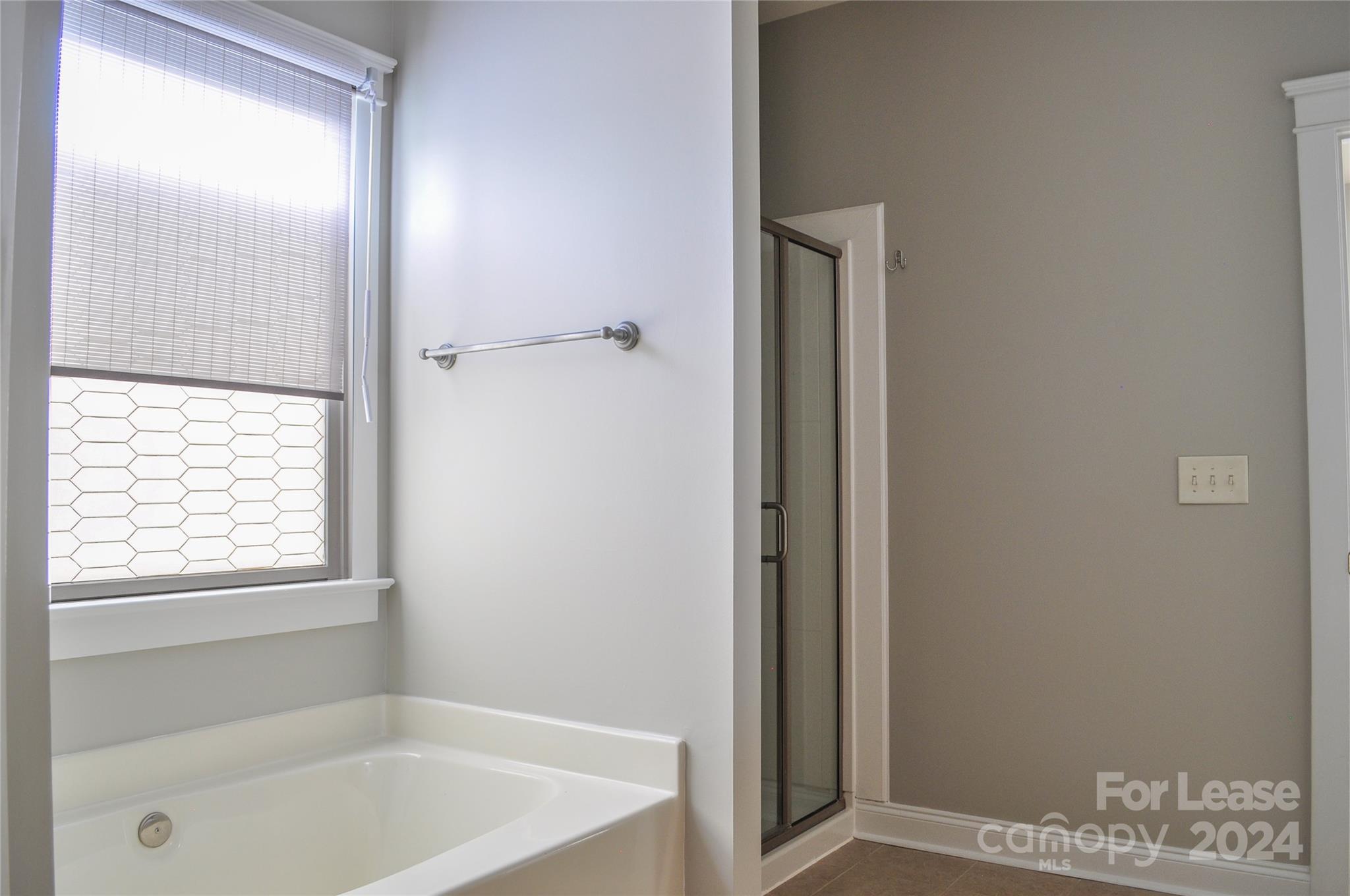 3010 Colonel Springs Way Fort Mill, SC 29708 - Photo 10 of 13 a bathroom with a bathtub and a shower