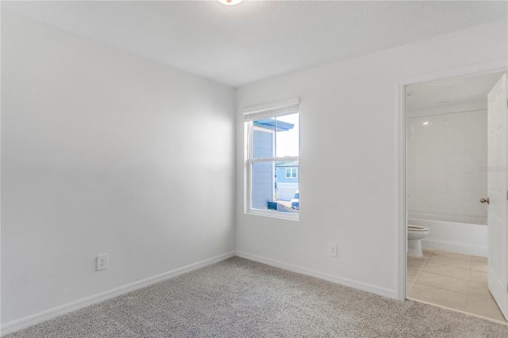 4319 Ranch House Road St. Cloud, FL 34772 - Photo 13 of 47 an empty room with windows and closet