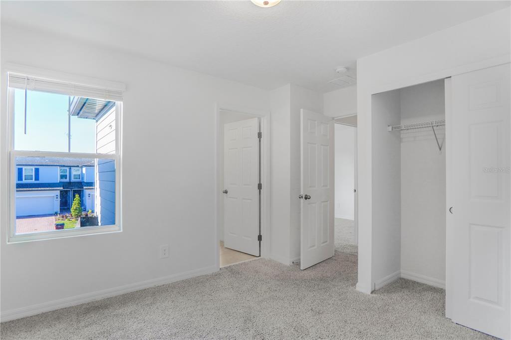 4319 Ranch House Road St. Cloud, FL 34772 - Photo 14 of 47 a view of an empty room with window and bathroom