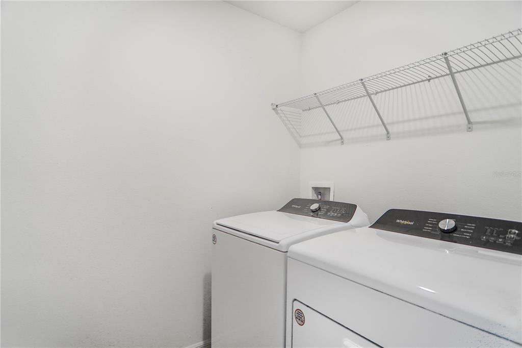4319 Ranch House Road St. Cloud, FL 34772 - Photo 20 of 47 a utility room with dryer and washer