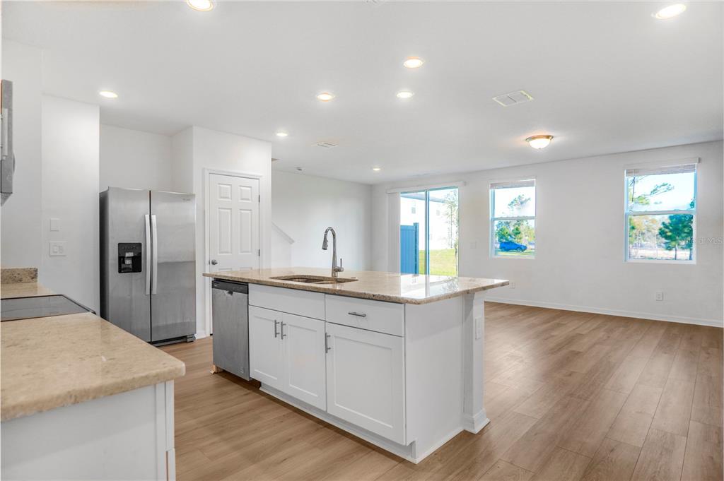 4319 Ranch House Road St. Cloud, FL 34772 - Photo 2 of 47 a kitchen with stainless steel appliances granite countertop a sink a stove a refrigerator and a granite counter tops