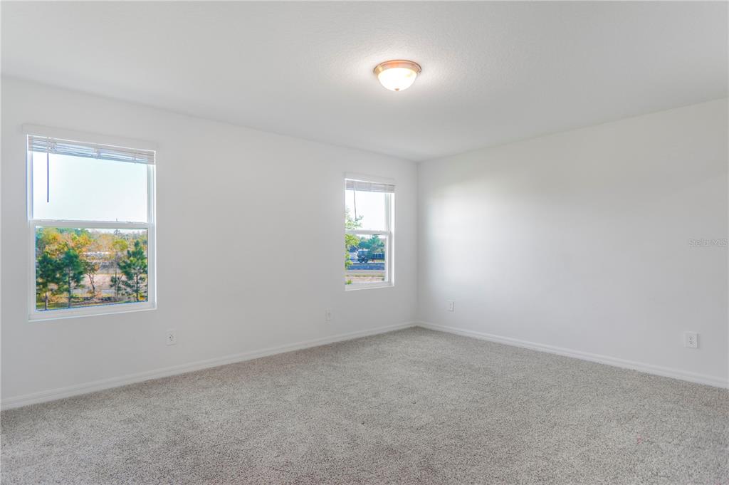 4319 Ranch House Road St. Cloud, FL 34772 - Photo 21 of 47 an empty room with windows