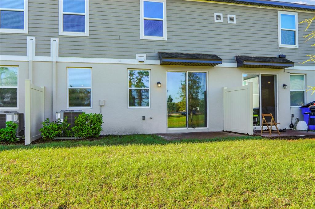 4319 Ranch House Road St. Cloud, FL 34772 - Photo 30 of 47 a view of a house with backyard and porch