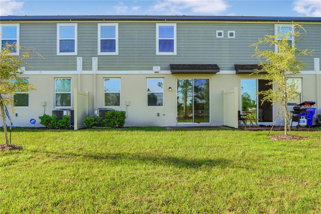 4319 Ranch House Road St. Cloud, FL 34772 - Photo 31 of 47 a view of a house with a yard and plants