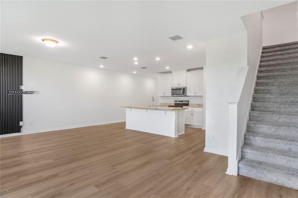 4319 Ranch House Road St. Cloud, FL 34772 - Photo 5 of 47 a view of kitchen with wooden floor and electronic appliances