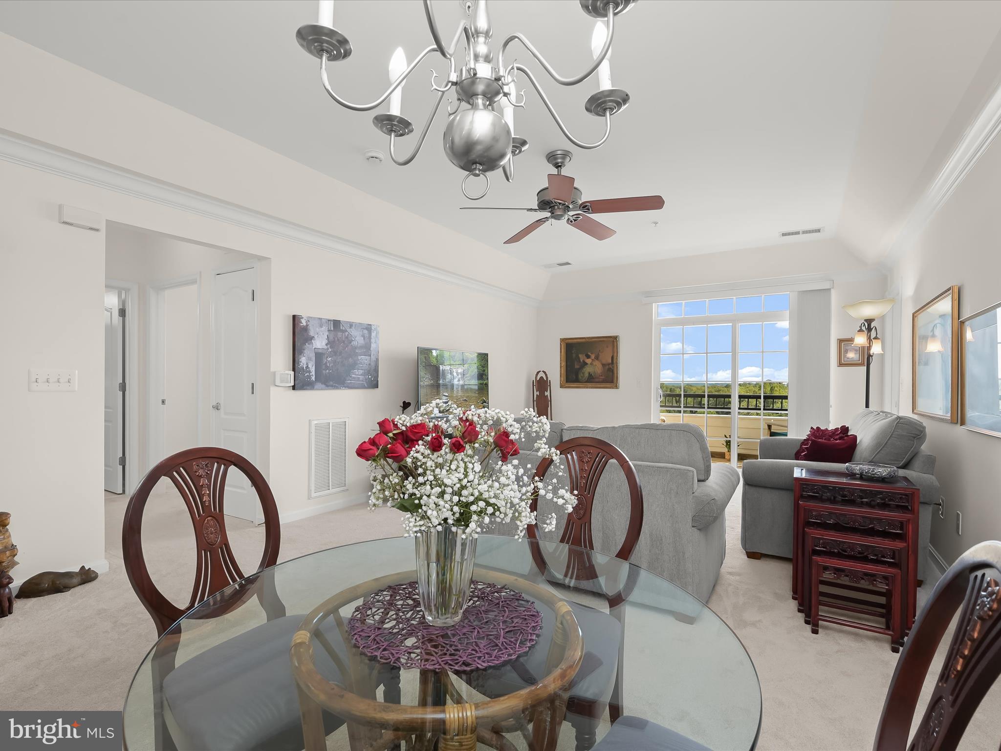 7325 Brookview Road, Unit 305 Elkridge, MD 21075 - Photo 11 of 40 a dining room with furniture a chandelier and window
