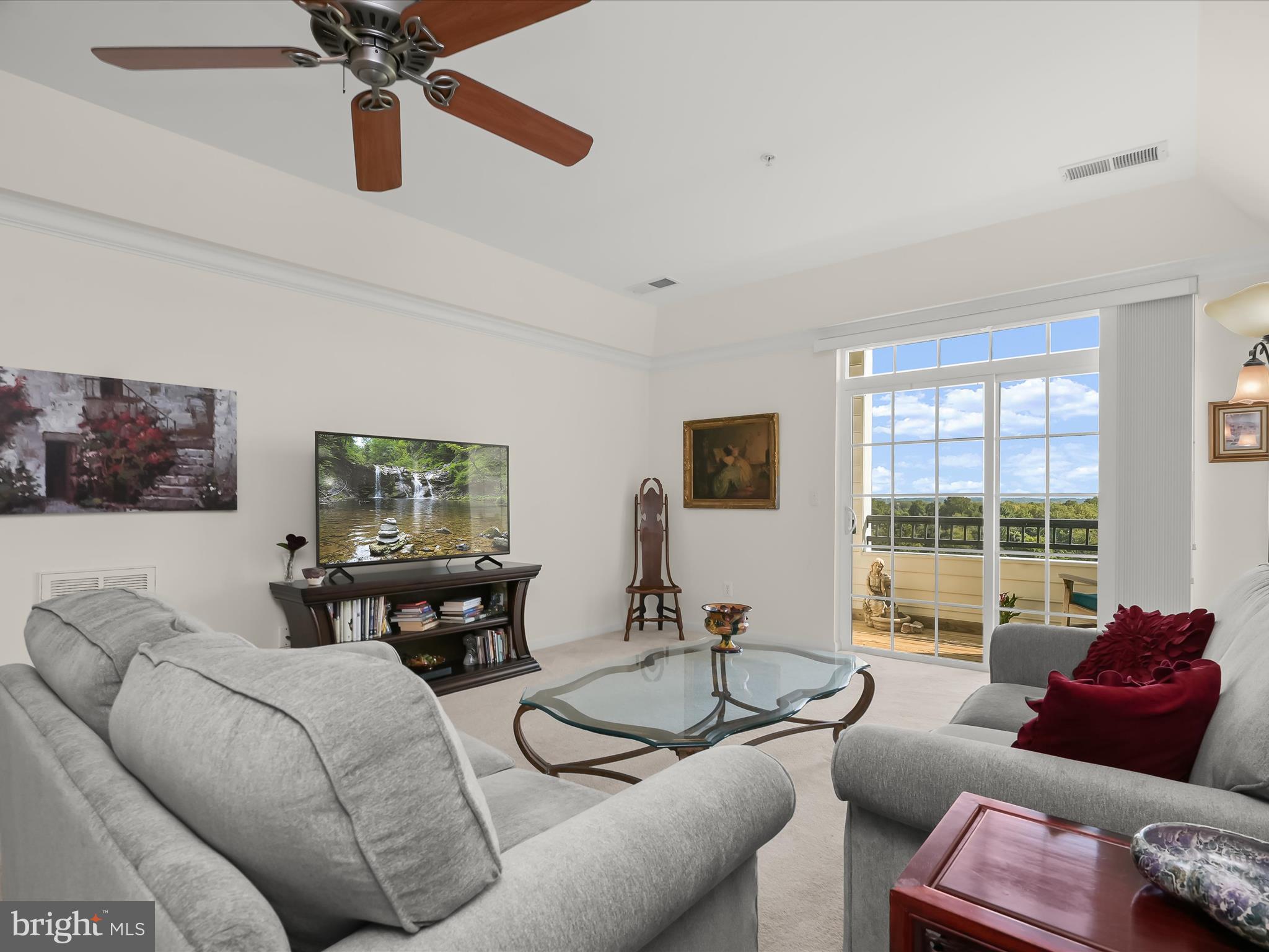 7325 Brookview Road, Unit 305 Elkridge, MD 21075 - Photo 13 of 40 a living room with furniture and a large window