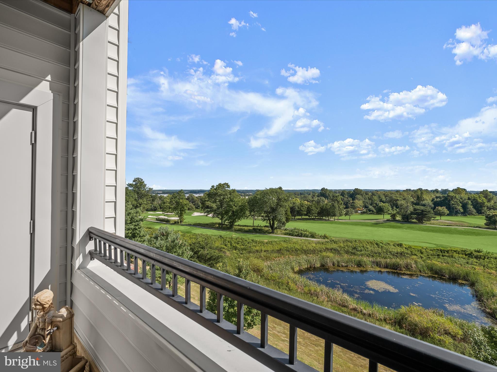 7325 Brookview Road, Unit 305 Elkridge, MD 21075 - Photo 16 of 40 a view of a wooden deck with a yard