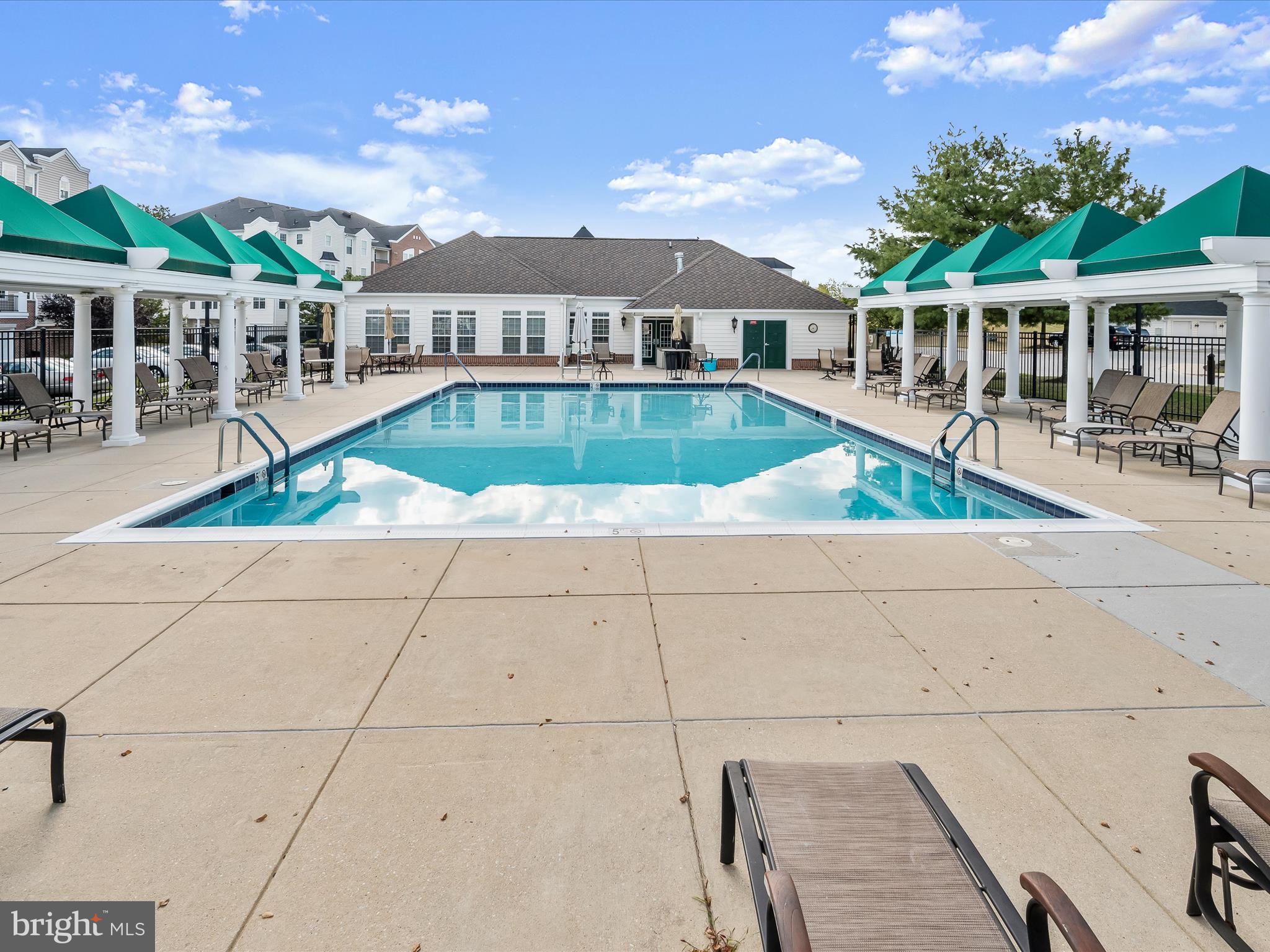 7325 Brookview Road, Unit 305 Elkridge, MD 21075 - Photo 2 of 40 a view of a house with a swimming pool