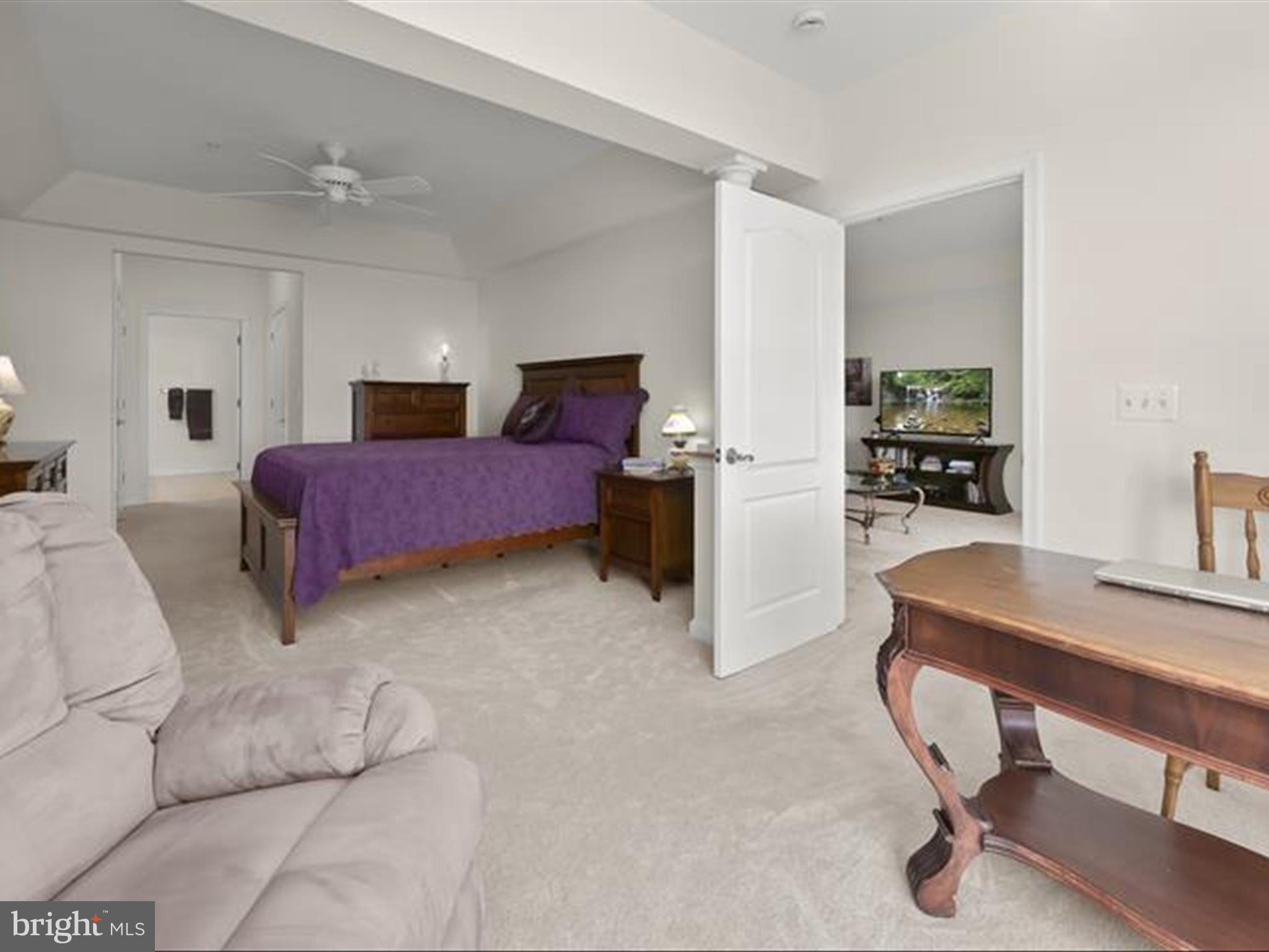 7325 Brookview Road, Unit 305 Elkridge, MD 21075 - Photo 21 of 40 a bedroom with furniture and a chandelier
