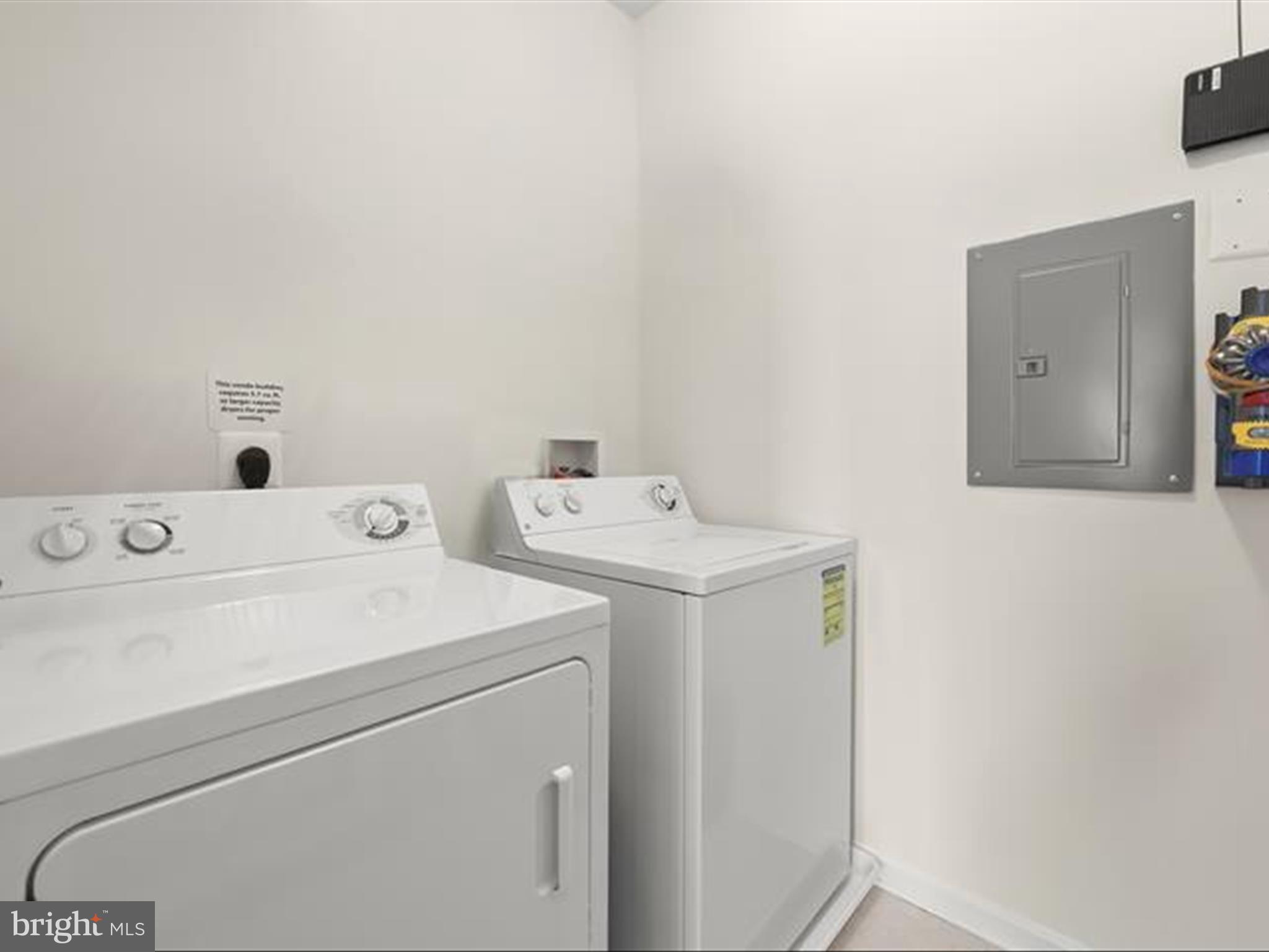7325 Brookview Road, Unit 305 Elkridge, MD 21075 - Photo 32 of 40 a utility room with dryer and washer
