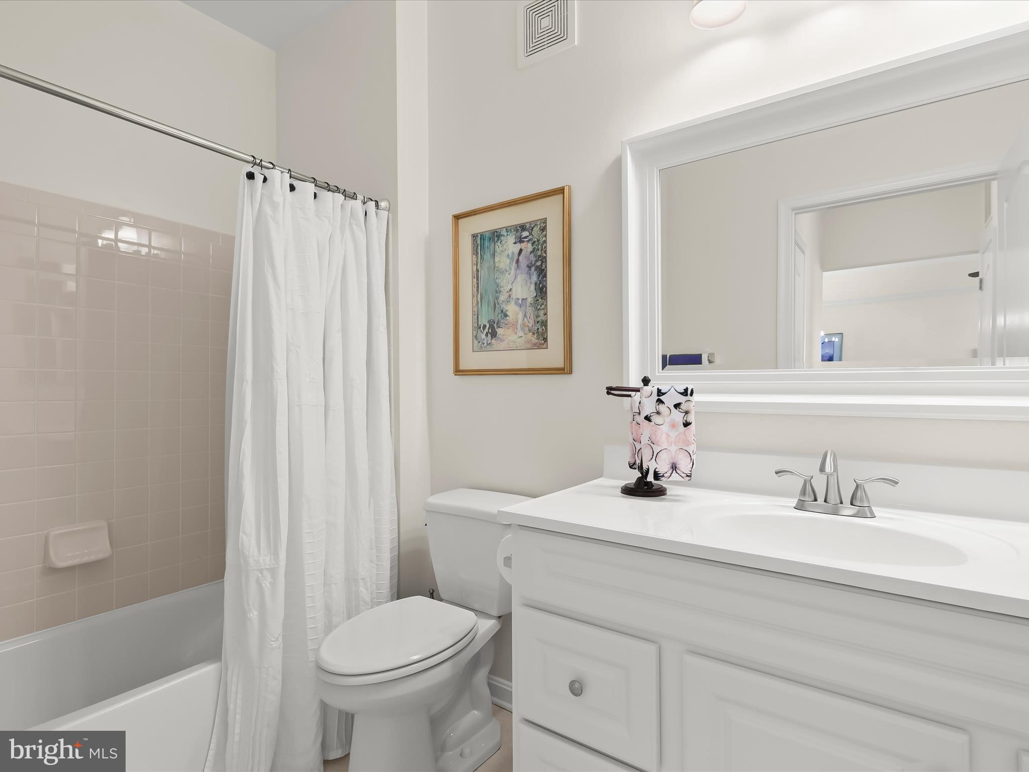 7325 Brookview Road, Unit 305 Elkridge, MD 21075 - Photo 33 of 40 a bathroom with a sink toilet and shower