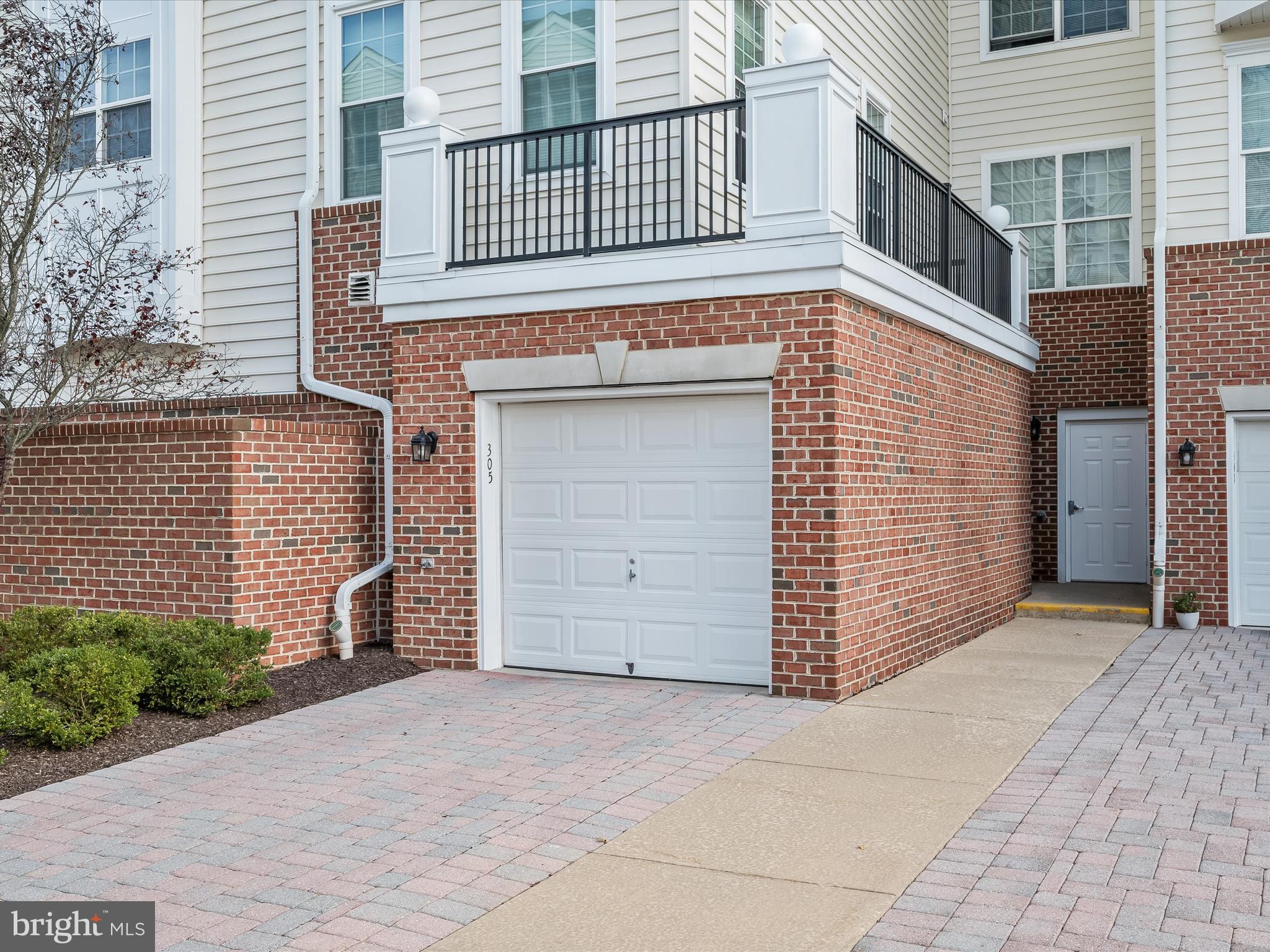 7325 Brookview Road, Unit 305 Elkridge, MD 21075 - Photo 36 of 40 a front view of a house with a garage
