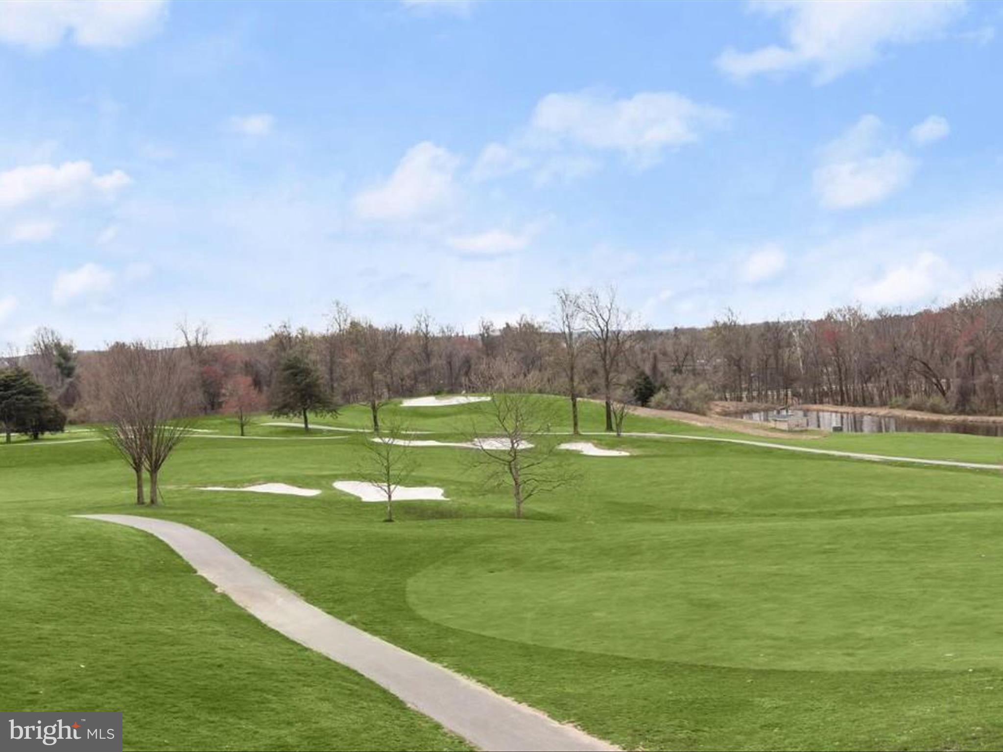 7325 Brookview Road, Unit 305 Elkridge, MD 21075 - Photo 39 of 40 a view of a golf course with a lake