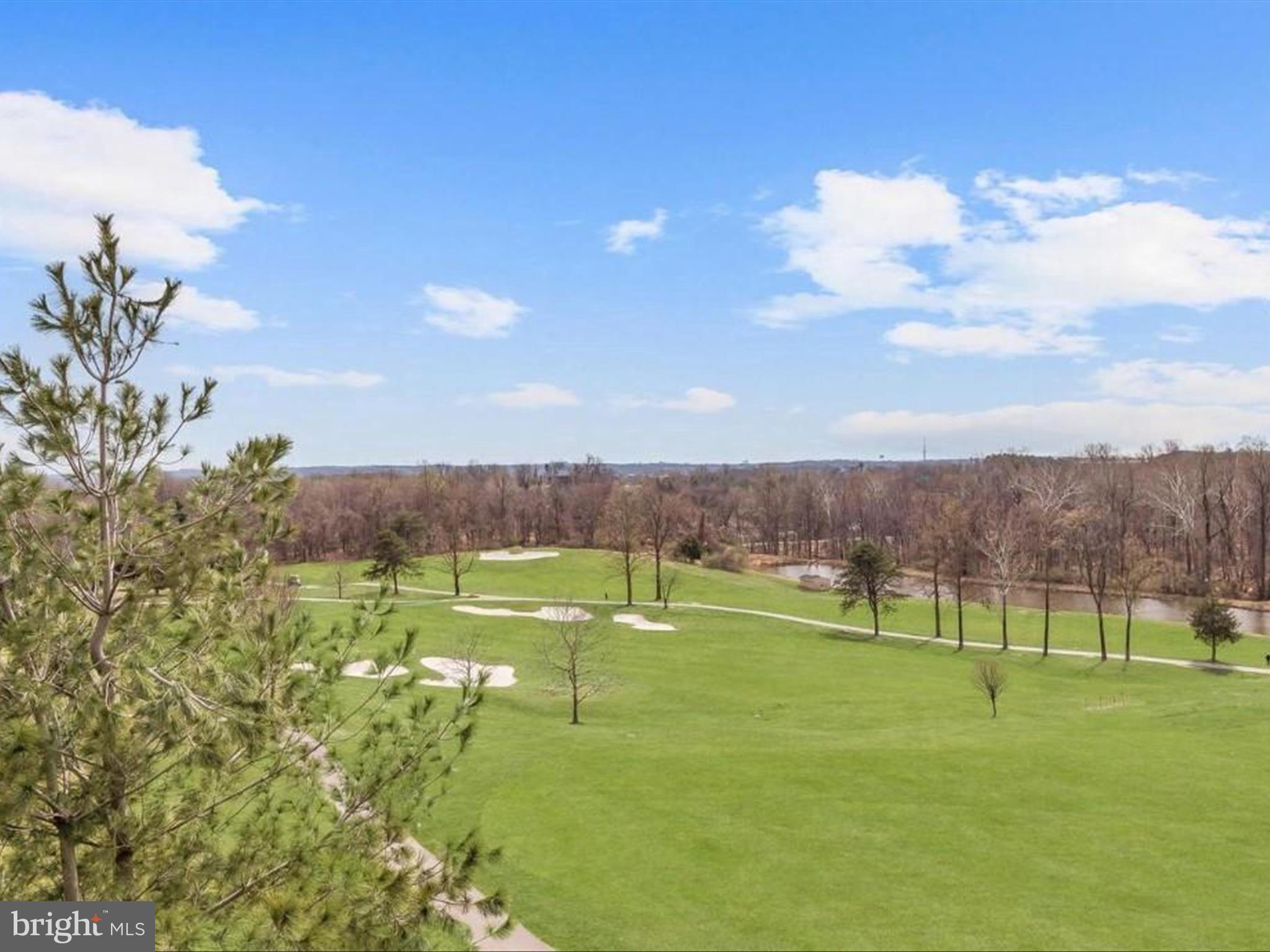 7325 Brookview Road, Unit 305 Elkridge, MD 21075 - Photo 4 of 40 a view of a golf course with a lake