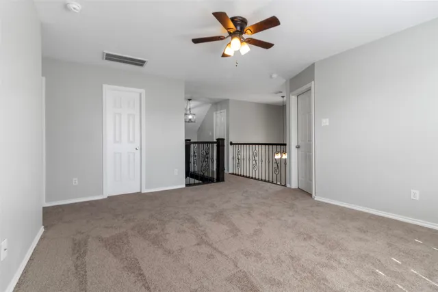 a view of a kitchen with a sink and a refrigerator