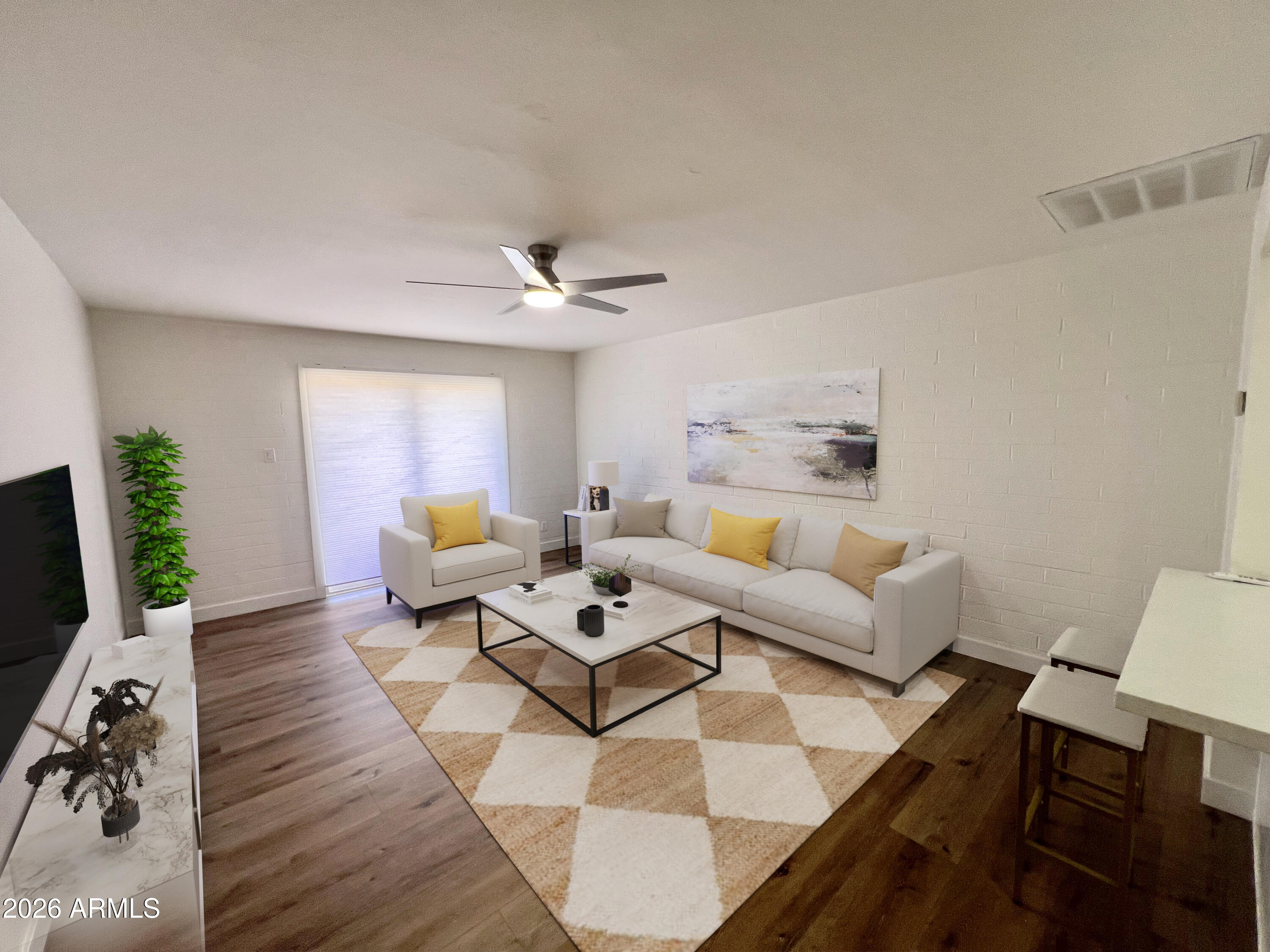 3818 West Ruth Avenue Phoenix, AZ 85051 - Photo 7 of 20 a living room with furniture and wooden floor