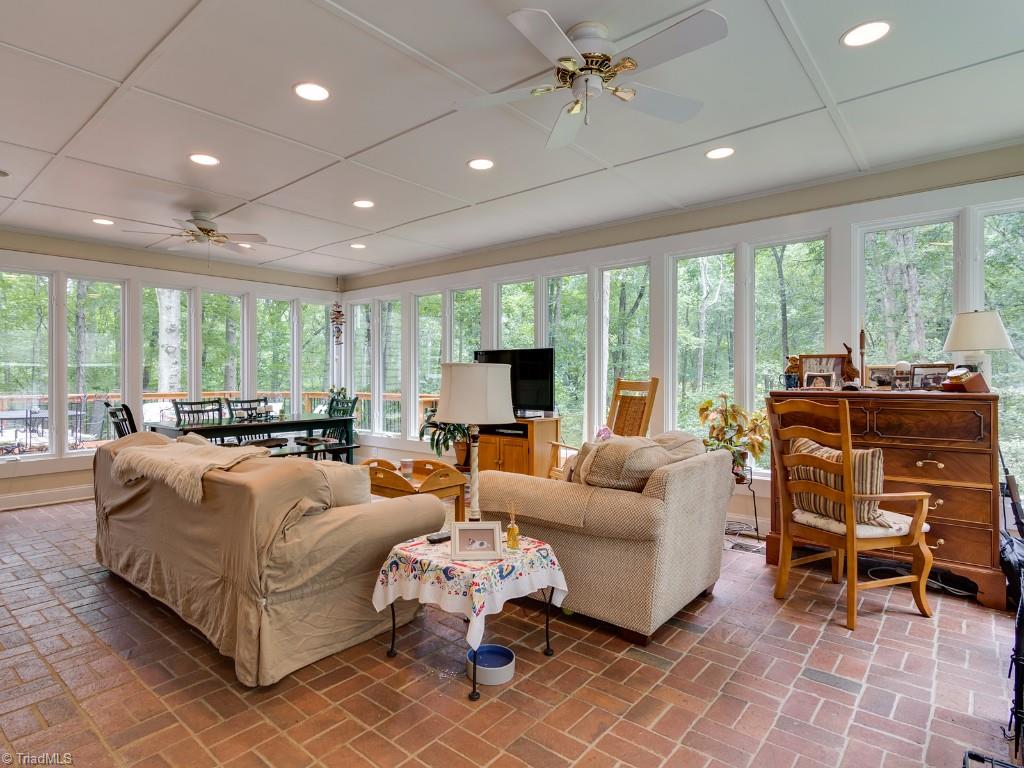7103 Haw Ridge Road Summerfield, NC 27358 - Photo 11 of 30 Sunroom with brick paver flooring.