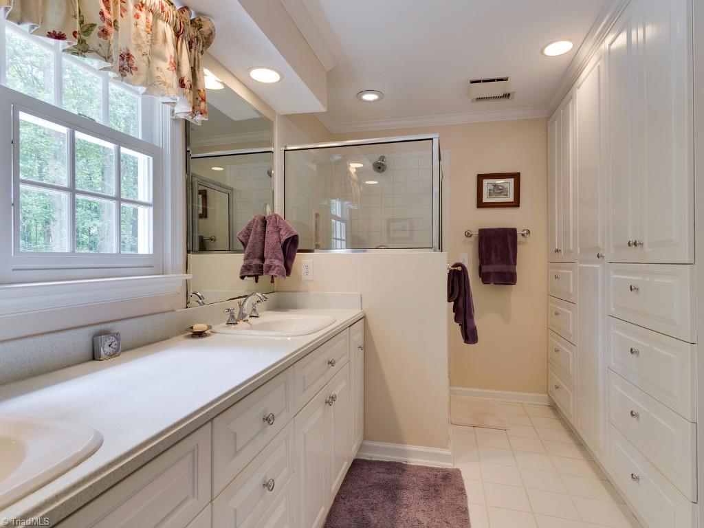 7103 Haw Ridge Road Summerfield, NC 27358 - Photo 15 of 30 Master Bath with built-in cabinets.