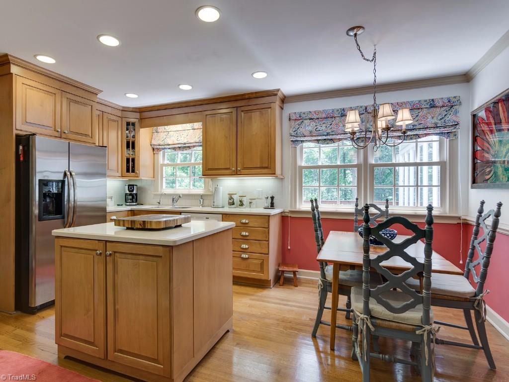 7103 Haw Ridge Road Summerfield, NC 27358 - Photo 6 of 30 Kitchen with beautiful cabinets and wood floors.