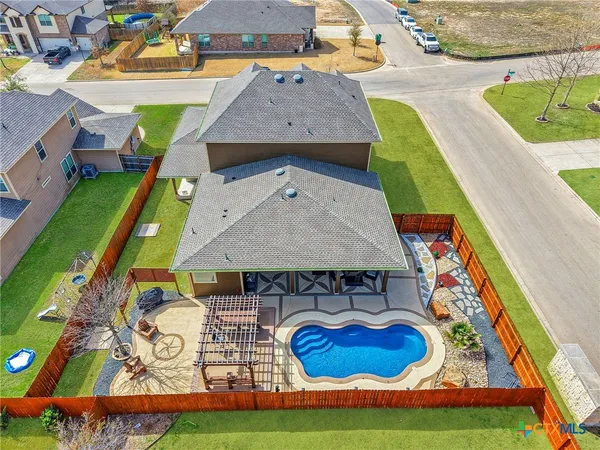 a aerial view of a house with swimming pool