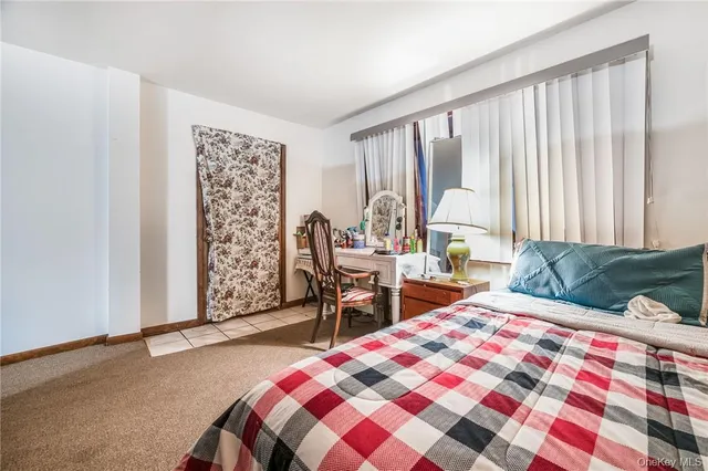 a bedroom with a bed and a closet