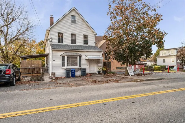 a view of a house with a street