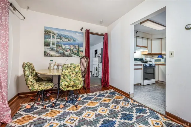 a kitchen with cabinets appliances and a window