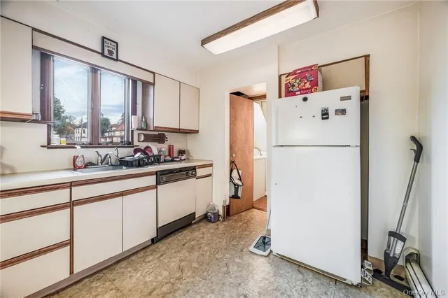 a kitchen with stainless steel appliances granite countertop a stove sink and cabinets