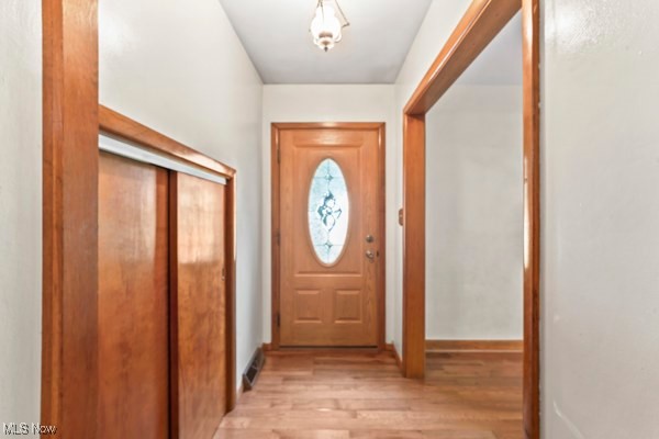 14413 Macklin Road New Springfield, OH 44443 - Photo 22 of 49 Doorway featuring wood finished floors and baseboards