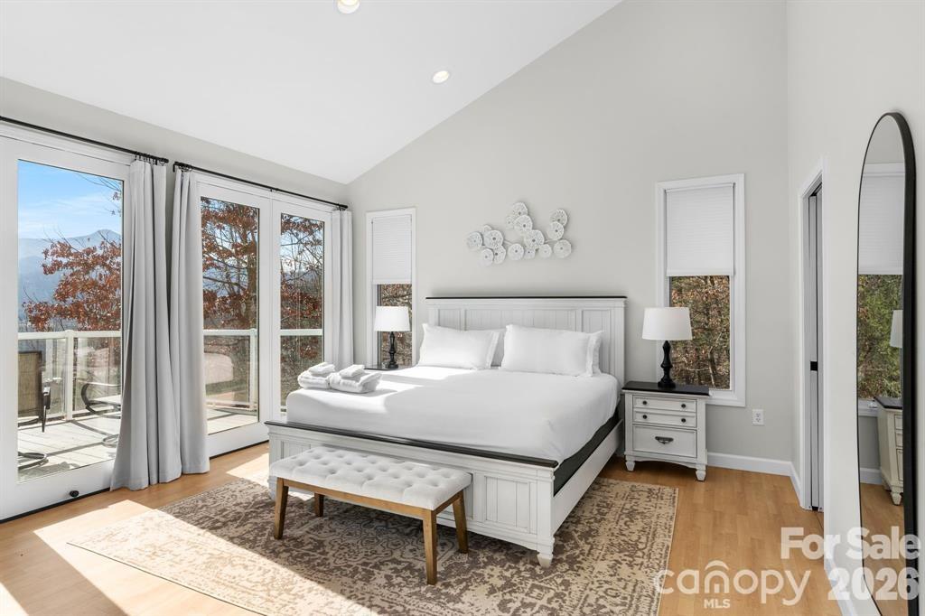 56 Great Horned Owl Road Candler, NC 28715 - Photo 12 of 32 a bedroom with a bed and a window
