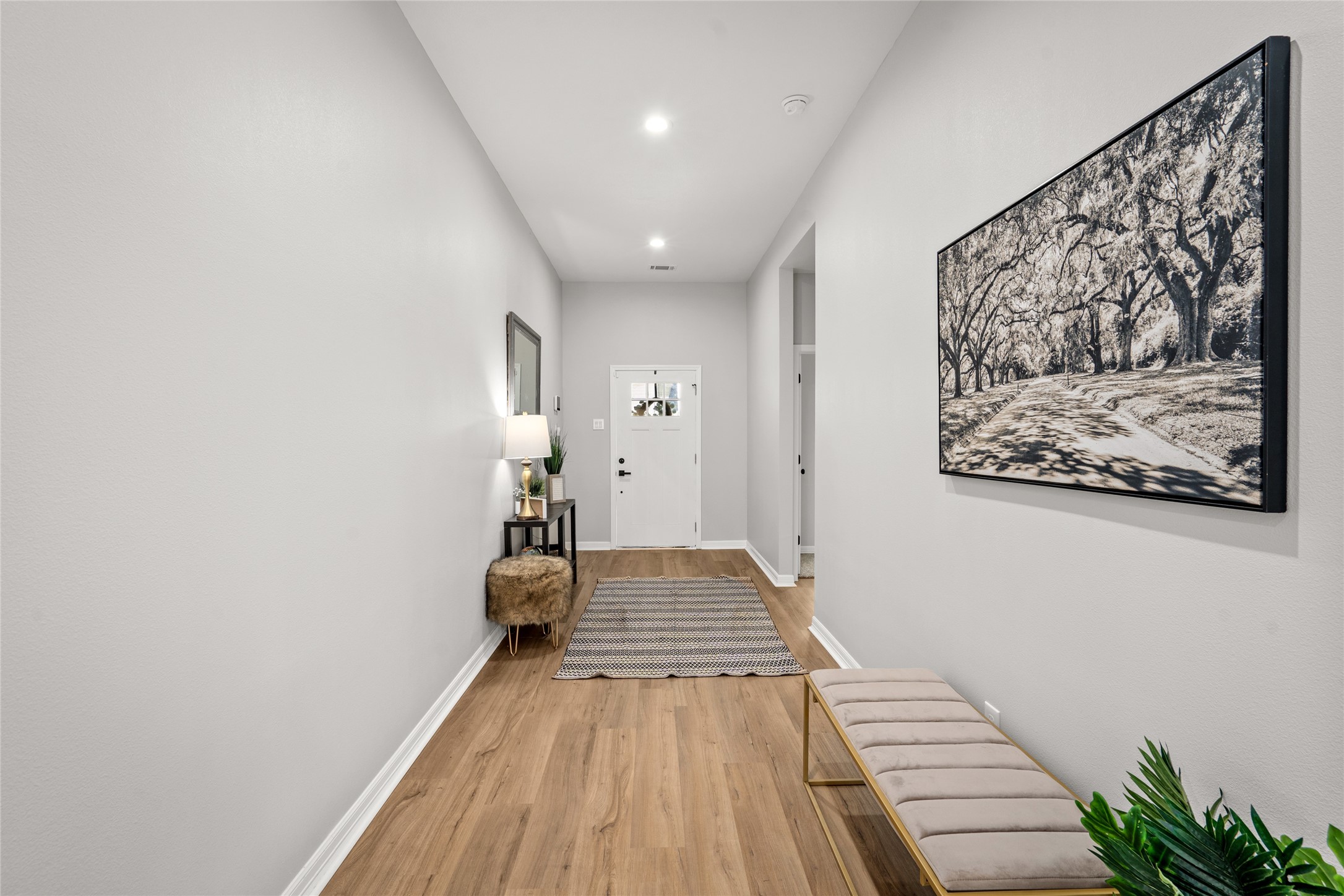 14307 Laredo Street Houston, TX 77015 - Photo 12 of 38 a view of a hallway with wooden floor and workspace
