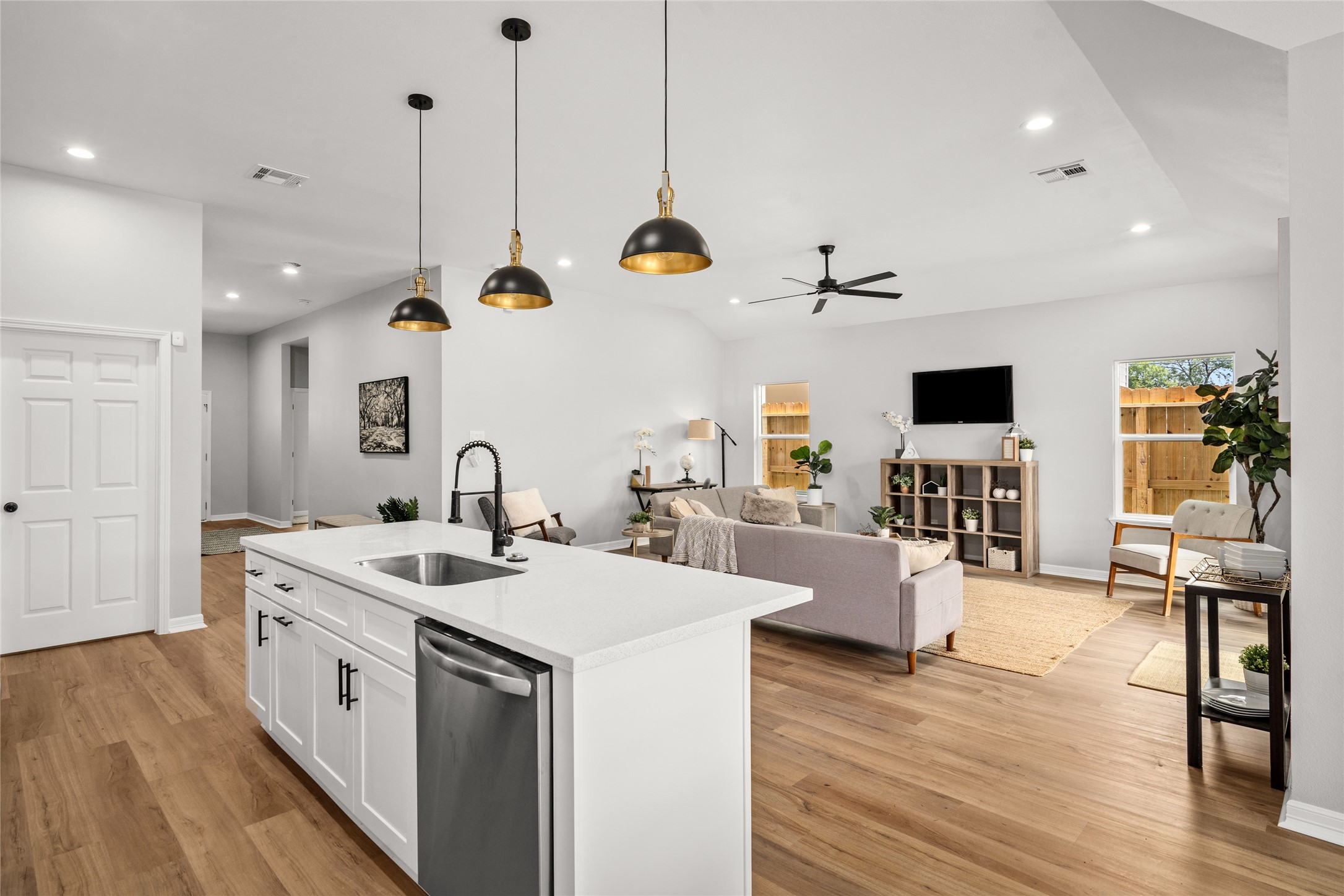 14307 Laredo Street Houston, TX 77015 - Photo 22 of 38 a open kitchen with stainless steel appliances granite countertop a stove and wooden floor