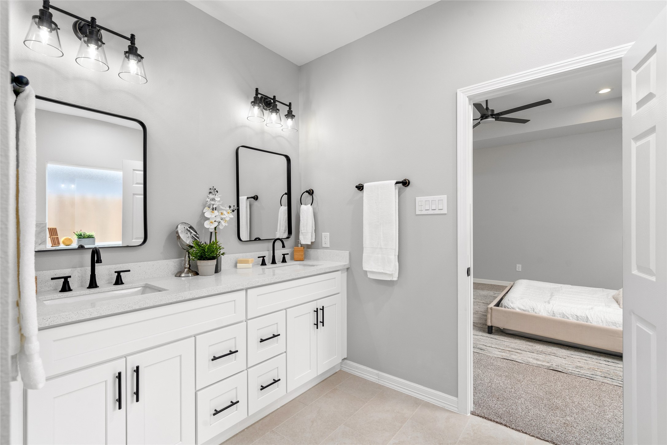 14307 Laredo Street Houston, TX 77015 - Photo 23 of 38 a en suite bathroom with double sink and a mirror