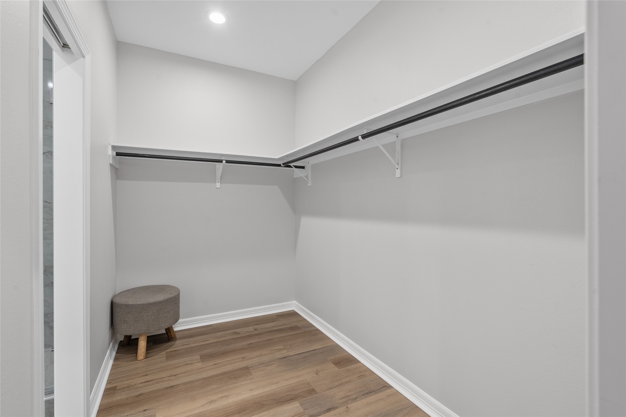 14307 Laredo Street Houston, TX 77015 - Photo 25 of 38 a view of a small room with wooden floor and a window